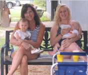 Cindy Graff(left) holding granddaughter McKena Graff and Cindy's daugher Crissy Cahill (right) holding holding son D. J. Cahill.